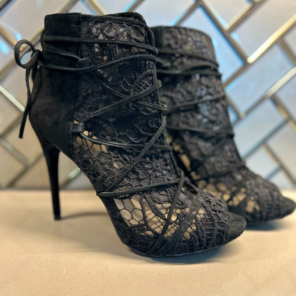 Black lace, 4.5” heel, lace up shoe/bootie. Worn only once! Sexy!!